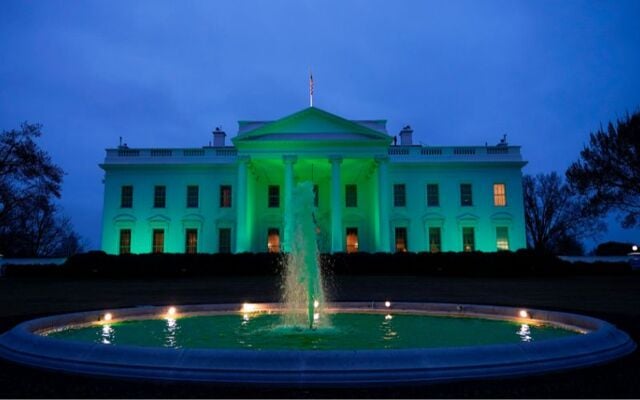 The White House in Washington, DC lit up green for St. Patrick\'s Day in 2021.
