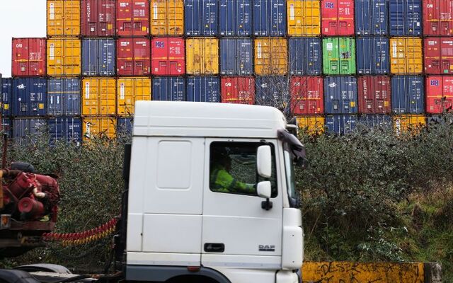 February 1, 2021: A truck passing by shipping / cargo containers in Dublin Port.