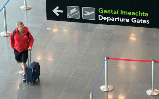 Signs pointing toward Departure Gates in Dublin Airport.