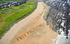 Irish artist unveils "Free Palestine" sand art message in front of Trump's Irish golf course