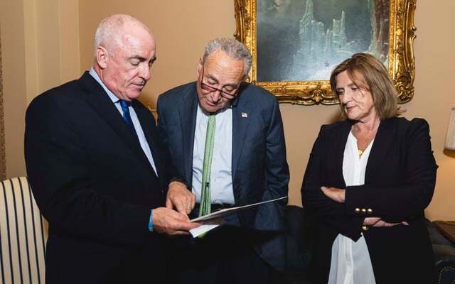 (L to R): Ciaran Staunton, Senator Chuck Schumer, and Orlaith Staunton in 2024.