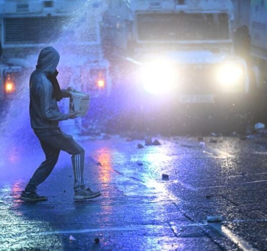Hatchet thrown at police during third night of "unacceptable" disorder in Northern Ireland