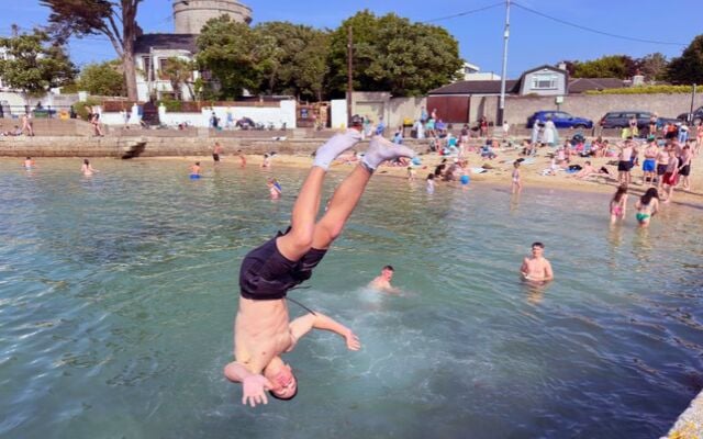 June 16, 2025; Swimmers at Sandycove Beach in Dublin.