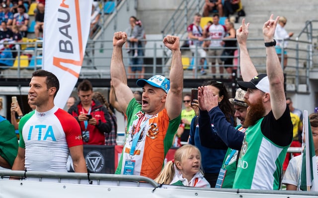 Irish supporters cheer on Team Ireland participants at an Obstacle Course Racing event. 