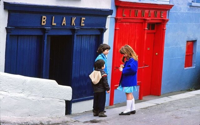Sharing sweets outside of Blake\'s in Ennistymon, Co Clare.