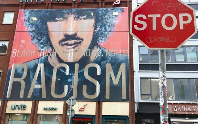 April 23, 2025: An anti-racism banner featuring musician Phil Lynott hangs on the front of the Unite union building in Dublin.