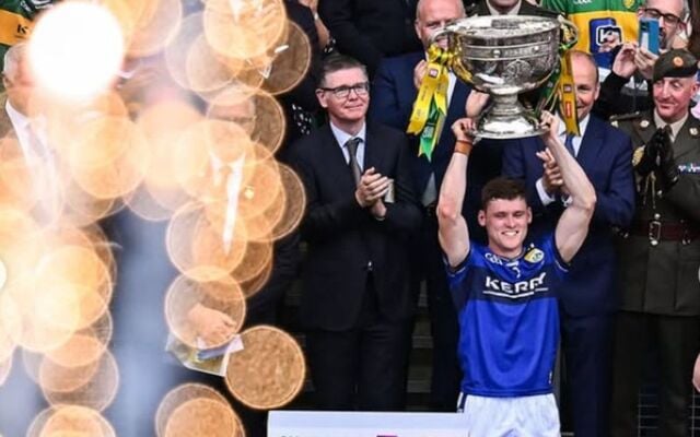 Gavin Smith, the Kerry GAA captain, hold the Sam Maguire Cup above his head at Croke Park.