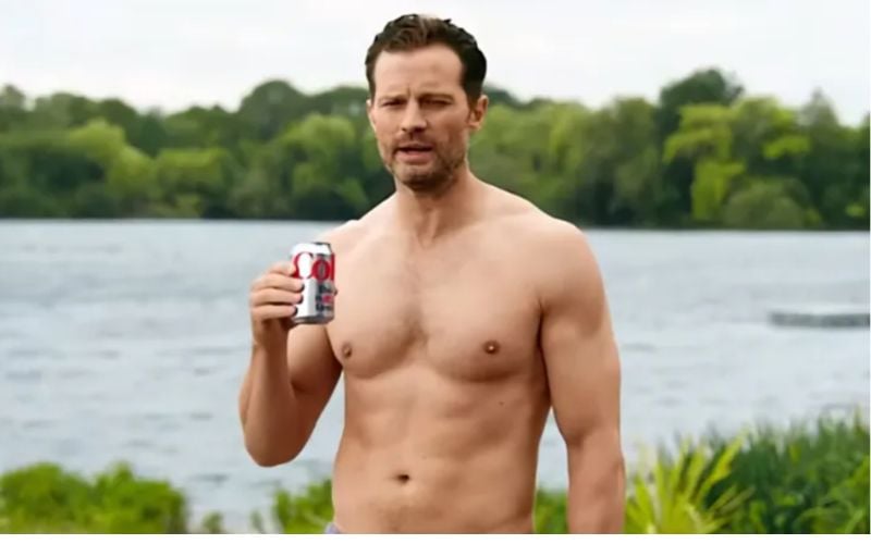 Shirtless Jamie Dornan raises temperatures in new Diet Coke sea swimming ad