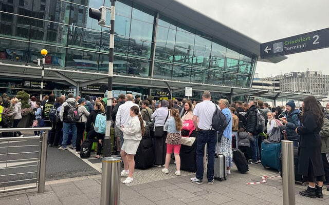 Passengers queue outside Terminal 2 at Dublin Airport after a security alert on Saturday, September 20, 2025. 