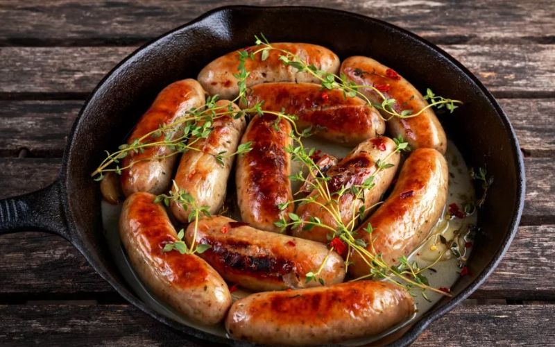 Irish cider-braised sausages with a tangy pickled twist