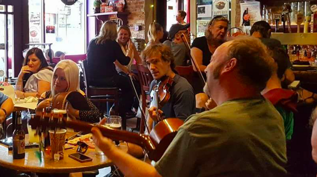 Enjoying live music in an Irish pub in New York.