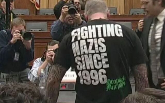 January 22, 2026: Michael Fanone wearing a Dropkick Murphys t-shirt that says \"Fighting Nazis since 1996\" while attending the House Judiciary Committee hearing with former special counsel Jack Smith.
