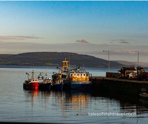 Moville pier on Lough Foyle, County Donegal. From 1861 until 1939, ocean liners anchored offshore here and emigrants were ferried down to them from Derry.