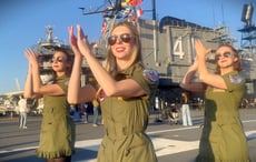 Fusion Fighters release cinematic “Danger Zone” dance film shot on USS Midway flight deck