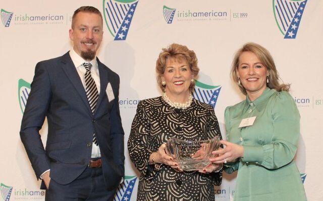 John Cummins and Adele Farrell receiving their Taoiseach Award from the Irish Ambassador to America, Geraldine Byrne Nason, at the IABCN Ambassador Awards, in 2023