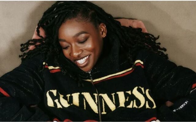 Little Simz wears the Guinness towelling jacket, €790 and matching Guinness towelling shorts, €490, the Guinness x JW Anderson collection.