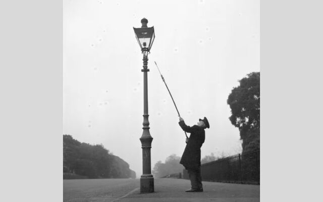 A lamplighter at work in Dublin\'s Phoenix Park.