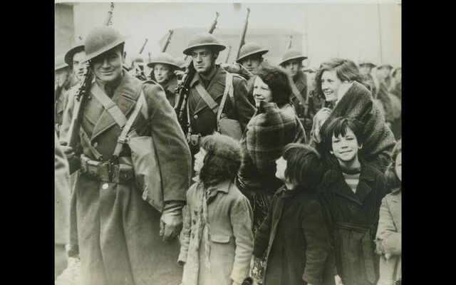 February 8, 1942: Women and children in a port “somewhere in Northern Ireland” as they greeted troops of the American Expeditionary Force, on its arrival.
