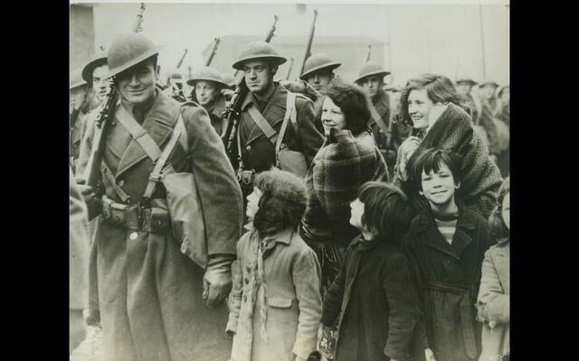 February 8, 1942: Women and children in a port “somewhere in Northern Ireland” as they greeted troops of the American Expeditionary Force, on its arrival.