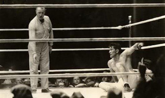 Tunny looking up a referee Dave Barry as he picks up the count.