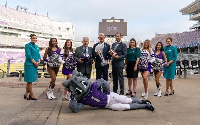 Senior Vice President of Global Sales (Aer Lingus) Bill Byrne, ALCFC Co-Founder John Anthony, Consul General of Ireland, Austin, Robert Hull, and Global Head of Sponsorship and Partnerships (Aer Lingus) Mary McGuire pose for a photo with Cabin Crew, TCU Spir