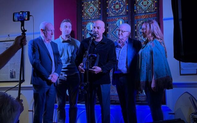 (L-R) Award presentation at the 2026 Tipperary International Song of Peace inside Templeneiry Old Church in Bansha, Co. Tipperary, Ireland: Tony Nolan, Scott Voelkerding, Leslie Bowe, Martin Quinn, and Caitriona O\'Sullivan.
