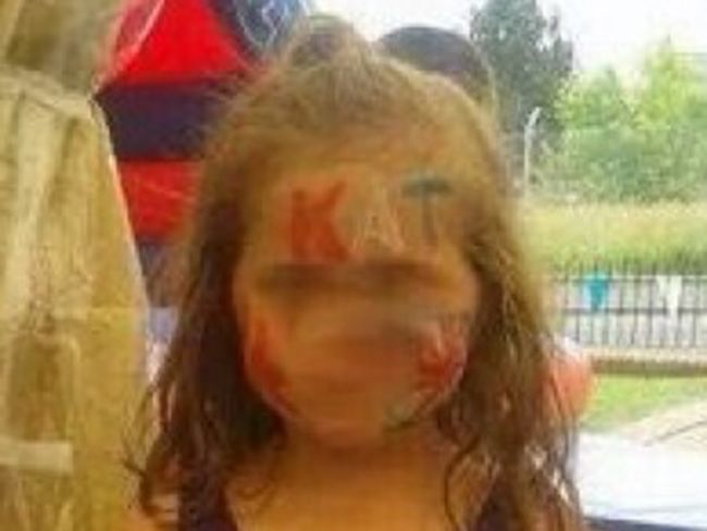 Police investigate photo of little girl with Catholic death threat face paint