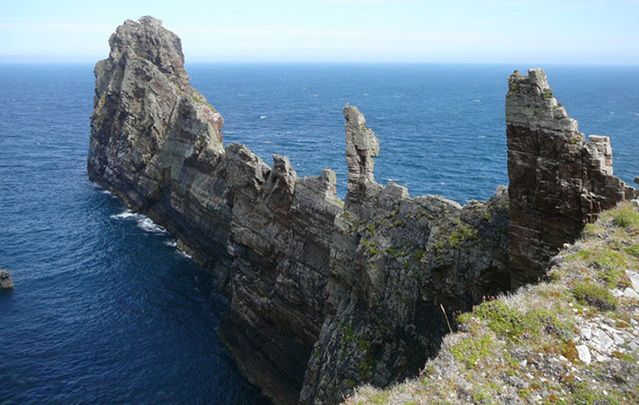 This spectacular blade of rock thrusts out into the Atlantic at the north eastern corner of Tory Island and reaches almost 80 metres high.