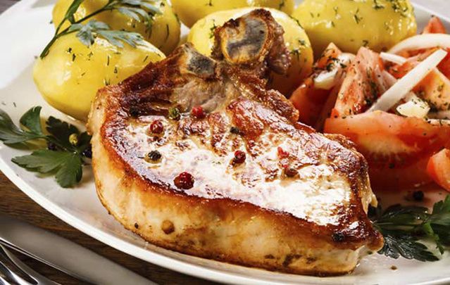 Pork Chops with Guinness and Onion Gravy is delicious paired with vegetables and roasted potatoes.