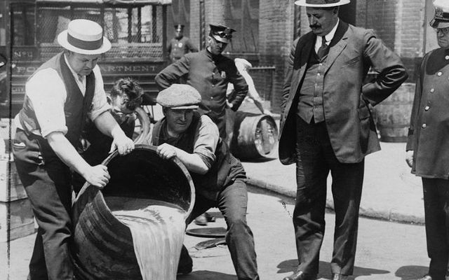 Officials dispose of liquor during the Prohibition era in the US. 