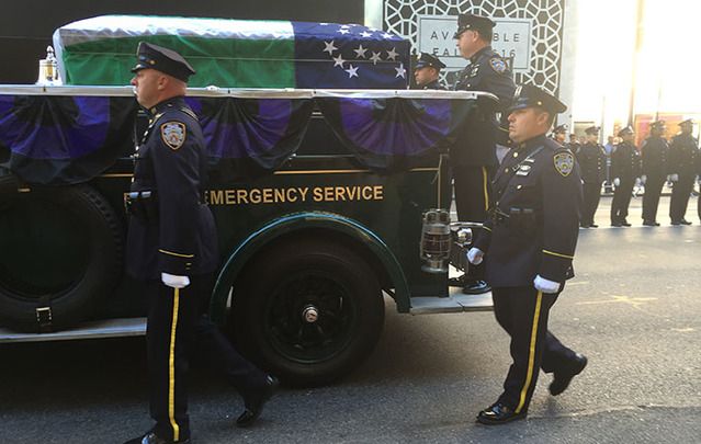 Police line Fifth Avenue to pay respects to John Timoney on Tuesday morning.