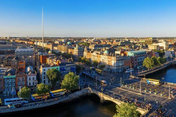 An aerial view of Dublin with the River Liffey, O\'Connell Bridge, and the Spire.