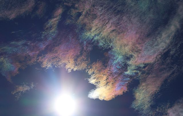 Colorful clouds caused by high winds and cold atmospheric temperatures brings beauty before the gales.