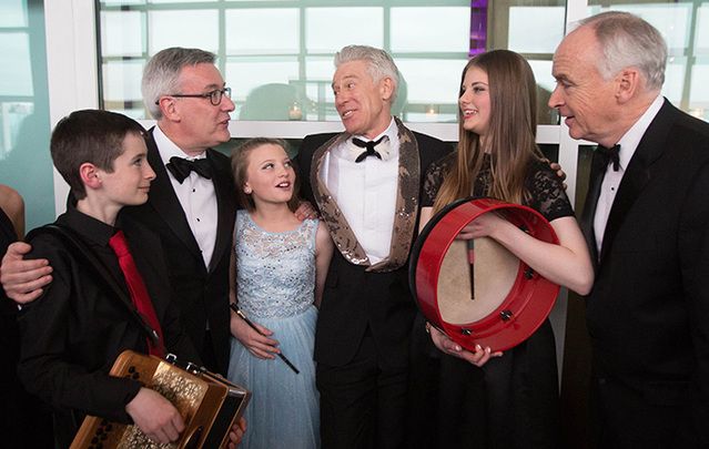 Young musicians from Music Generation speak with Kieran McLoughlin, president and CEO of The Worldwide Ireland Funds, Adam Clayton of U2, and John Fitzpatrick, chairman of The American Ireland Fund, d