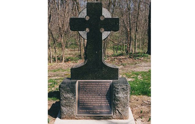 Many people have heard of the Irish rail workers mass grave in Duffy’s Cut, PA, but few know about Funks Grove, IL. Above: The Celtic cross installed there in 2000.