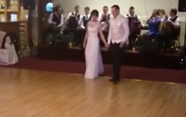 Snapshot of wedding dance video of Aoife Neville and Seán Longe, who surprised guests at their wedding with a lively Irish step dance.