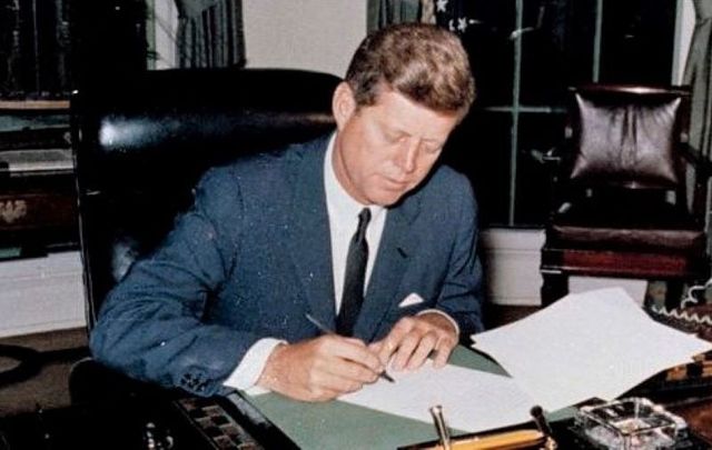 October 23, 1962: President John F. Kennedy signs the Interdiction of the Delivery of Offensive Weapons to Cuba in the Oval Office of the White House in Washington, D.C.