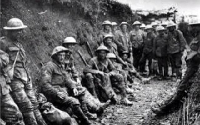 July 1, 1916: Troops of the Royal Irish Rifles resting in a communication trench during the opening hours of the Battle of the Somme. [Royal Engineers No 1 Printing Company / Imperial War Museum]