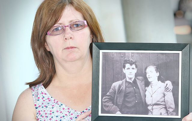 Janet Donnelly with a photo of her mother and father, Mary Ellen and Joseph Murphy.