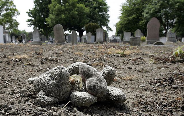 A child's teddy bear marks the spot where the unmarked graves of 40 children from a Protestant residential institution, Bethany House, were discovered in Mount Jerome Cemetery in Dublin.