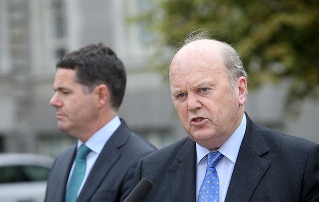 Irish Finance Minister Michael Noonan and the Minister for Public Expenditure and Reform, Paschal Donohoe, speaking to reporters after the special cabinet meeting at Government Buildings in Dublin ear