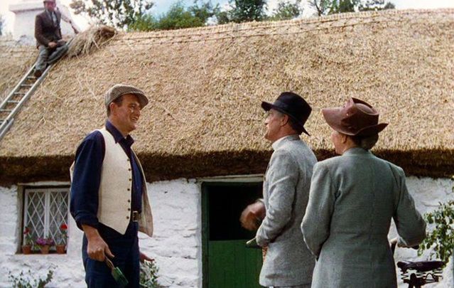 Still of John Wayne and the White O'Morn cottage, in County Galway, from The Quiet Man.