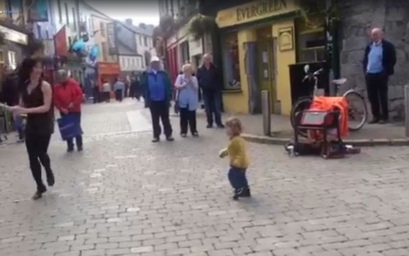 WATCH: Irish dancer joined by enthusiastic toddler on the streets of Galway