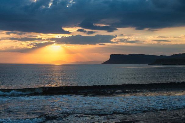 The sun set at Ballycastle, in County Antrim.