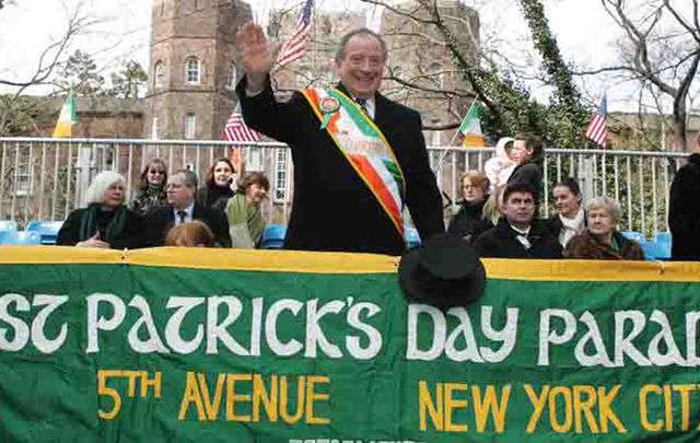 Former Parade and Celebration Committee chairman John Dunleavy, waving to the crowds at a St. Patrick's Day Parade.