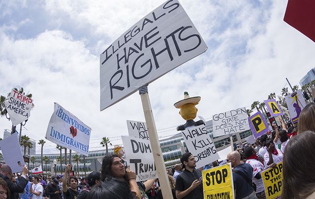 Protestor's hold pro-immigration reform poster aloft.