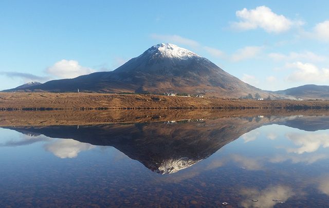 All is still and calm. Dunlewey Lake, in County Donegal with the Errigal Mountains in the background.