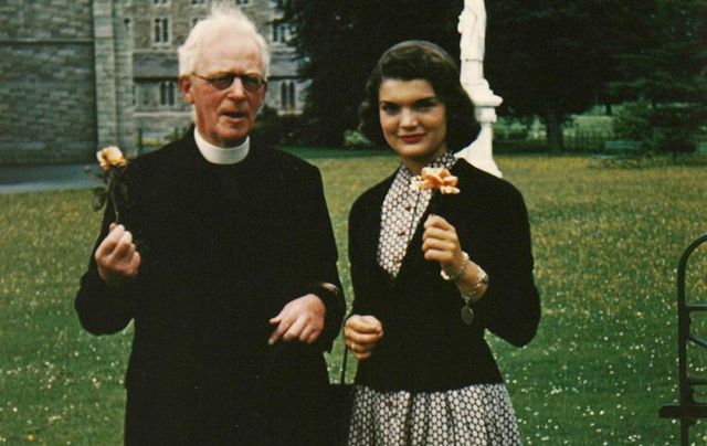 Father Joseph Leonard and Jackie Kennedy. 