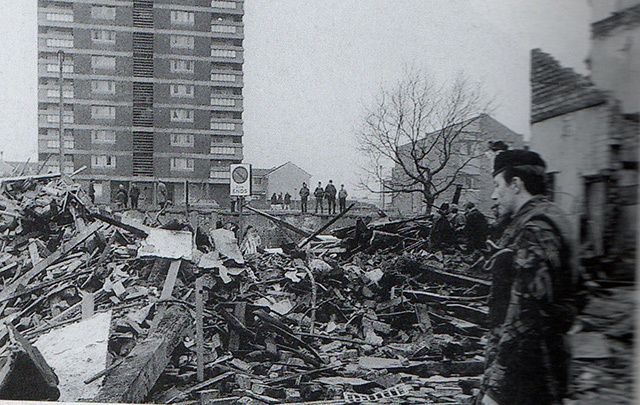 A British soldier surveys the aftermath of the bombing at McGurk\'s Bar in Belfast in December 1971. 