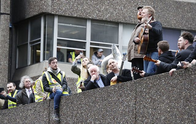 Jim Sheridan, the Coronas and Glen Hansard on the roof of Apollo House, playing a free gig for the public below.